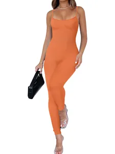 Detailed view of an orange ribbed backless bodycon jumpsuit showing fit and texture