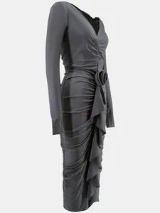 Macro detail of charcoal grey V-neck dress with rose accent and ruched ruffles.