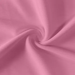 Macro view of high-quality pink ribbed fabric texture on a slim sleeveless vest dress