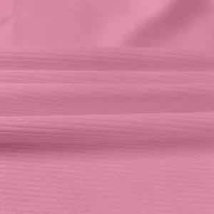 Close-up of soft pink ribbed fabric texture for summer sleeveless slim-fit dress detail