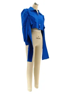 Side view of vibrant blue cropped shirt with puff sleeves and long ties on mannequin