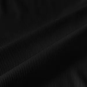 Detailed macro shot of black ribbed knitting fabric texture for slim fit dress
