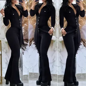 Full length view of elegant black long-sleeved jumpsuit with shirt collar and flared trousers