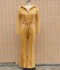 Elegant yellow long sleeve flared jumpsuit with shirt collar and adjustable waist belt
