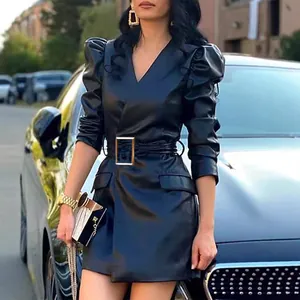 Close-up detail view of black faux leather mini dress with puff sleeves and belted waist