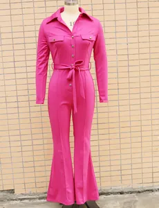 Fuchsia long-sleeve collared jumpsuit with tie belt and flared legs for chic commuter wear.