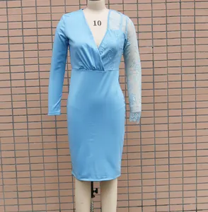 Detail showing elegant lace patchwork on light blue long sleeve bodycon dress