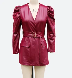 Burgundy faux leather mini dress with deep V-neck puff sleeves and gold buckle belt detail