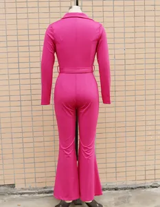 Detailed back view of a rose pink long sleeve jumpsuit featuring belt and flared leg design