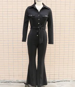 Detailed view of an elegant black long-sleeved jumpsuit with shirt collar and waist belt