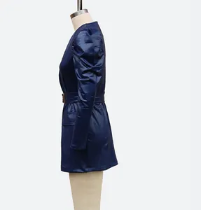 Side view detail of a stylish navy blue puff sleeve faux leather dress on a mannequin