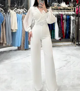 Elegant white long sleeve pleated jumpsuit featuring a blazer collar and belted waist.