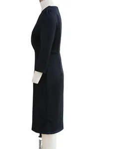 Side view of elegant black long-sleeve midi dress with stand collar and slim fit