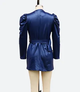 Detailed back view of a stylish navy blue faux leather dress featuring puff sleeves and a belt
