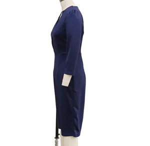 Elegant navy blue slim-fit long-sleeved dress side profile detail on white mannequin
