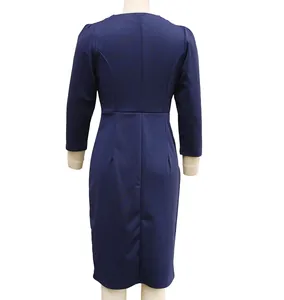 Detailed back view of an elegant navy blue slim-fit long-sleeved dress shown on a mannequin.