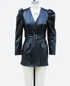 Frontal detail view of a black faux leather mini dress with V-neck and puff sleeves