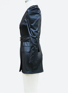 Side profile of a stylish black faux leather puff sleeve dress with a belted waist