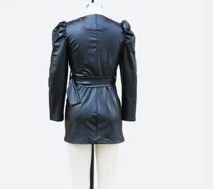 Back view of black faux leather mini dress with elegant puff sleeves and waist tie.