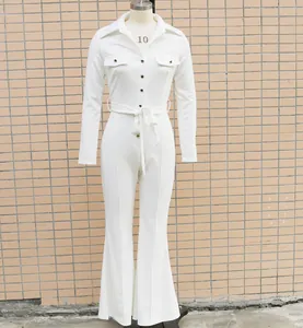 Detail view showing front of white long-sleeve jumpsuit with shirt collar and flare legs