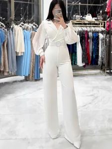Elegant white women's jumpsuit with pleated long sleeves, V-neck, and slim fit silhouette