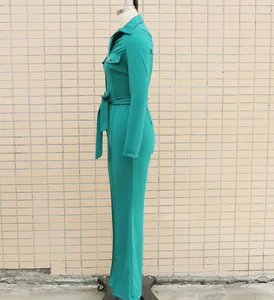 Elegant green long-sleeve jumpsuit with shirt collar and matching belt, side view detail
