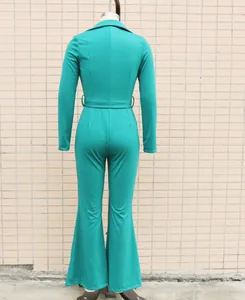 Back view of a teal long-sleeved jumpsuit with a waist belt and flared legs on a mannequin