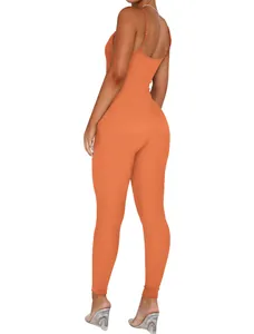 Back view of women's orange ribbed backless one-piece jumpsuit with slim spaghetti straps.