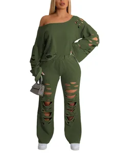 Olive green two-piece tracksuit with distressed ripped detailing and off-shoulder top
