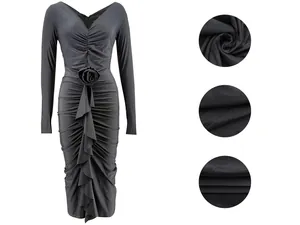 Close-up detail of fabric texture and 3D rose ruffle design on a grey long-sleeved dress.