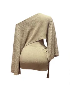Back view of a beige pleated one-shoulder top and matching tie-up mini skirt set