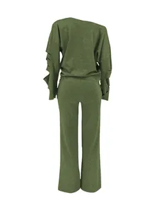 Back view of green ripped sleeve sweatshirt and matching straight leg pants set.