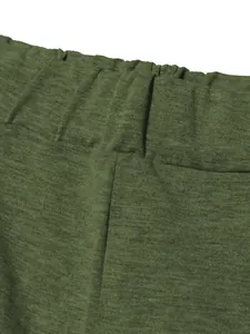 Macro view showing the olive green elastic waistband and premium knit fabric texture