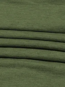 Macro detail shot of soft olive green knitted fabric for sports sweatshirt outfit