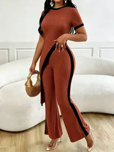 Textured two-piece set featuring slanted cut top and wide-leg pants detail view