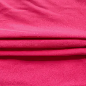 Macro view of vibrant fuchsia office dress fabric with soft knit pattern detail