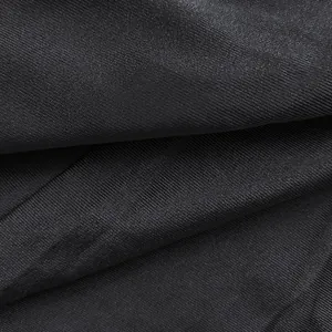 Macro shot of premium black ribbed fabric texture for this sexy long-sleeved bodycon dress.