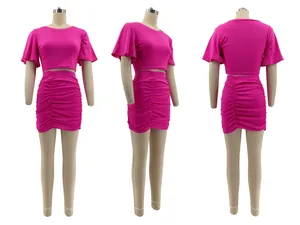 Bright pink two-piece set with crop top and ruched skirt shown from three angles