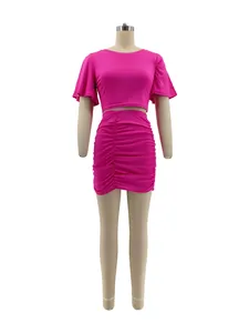 Hot pink two-piece set featuring a flutter-sleeve crop top and ruched mini skirt.