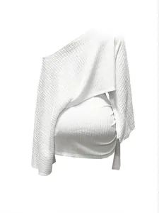 Back view detail of white one-shoulder top and ruched mini skirt set in ribbed fabric