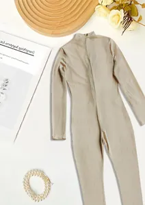 Minimalist beige ribbed knit long sleeve athletic jumpsuit with hidden back zipper