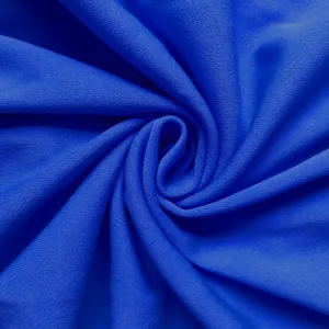 Close-up macro view showing the royal blue knitted fabric texture of the dress