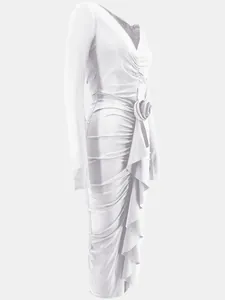 Detail of white long sleeve V-neck bodycon dress with 3D rose and ruffle accents