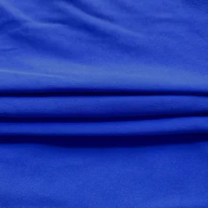 Detailed macro view of high quality royal blue knit fabric for elegant office dress