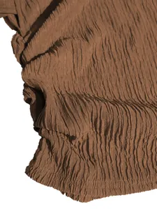 Close-up detail of the brown crinkled fabric texture on this elegant vacation outfit set
