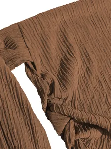 Close-up detail of the brown crinkled textured fabric on a fashionable summer set