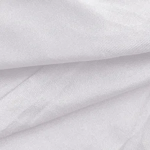 Macro view of premium white ribbed knit fabric texture on a sexy women's bodycon dress