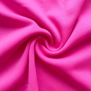 Close-up detail of hot pink knit fabric texture with spiral folds for women's clothing set