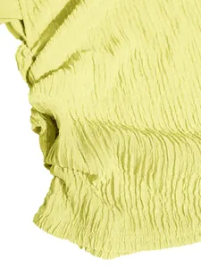Close-up of yellow crinkled fabric detail showing textured material for summer outfit