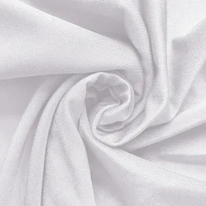 Close-up of white ribbed fabric with elegant rose-shaped drape design
